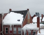 Insufficient Insulation melts snow at middle of roof prematurely.